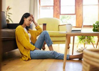 Stress, depression or burnout woman with laptop on living room floor for home finance, studying or house rent debt. Sad, anxiety and burnout student with mental health problem for online fail mistake
