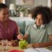Mother and her teenage son saving money in piggy bank