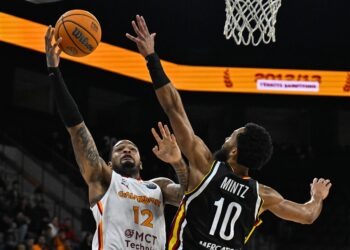ISTANBUL, TURKIYE - OCTOBER 21: Galatasaray MCT Technic's James Palmer (12) in action against Davion Mintz (10) of Wurzburg Baskets during the Basketball FIBA Champions League Group E match between Galatasaray MCT Technic and Wurzburg Baskets in Istanbul, Turkiye, on October 21, 2025. (Photo by Muhammed Enes Yldrm/Anadolu via Getty Images)