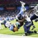 NASHVILLE, TENNESSEE - AUGUST 23: Will Levis #8 of the Tennessee Titans is tackled by D'Anthony Bell #23 and Aaron Smith #42 of the Seattle Seahawks during the second half of Week 2 of the preseason game at Nissan Stadium on August 23, 2026 in Nashville, Tennessee. (Photo by Johnnie Izquierdo/Getty Images)